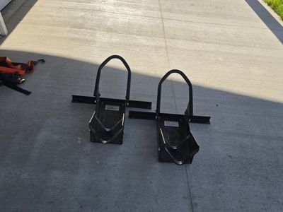 Motorcycle wheel chocks and tie downs