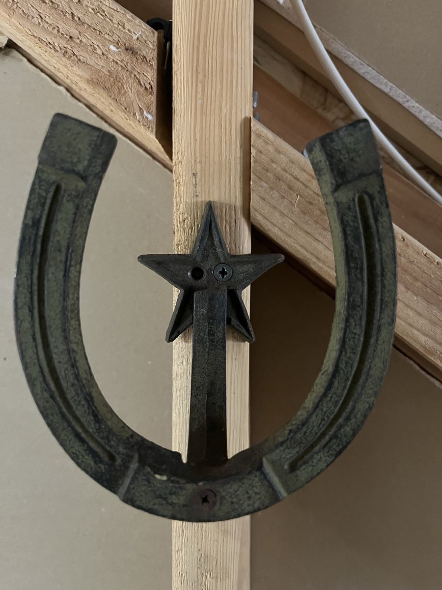 Two rustic horseshoe hangers