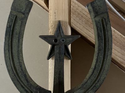Two rustic horseshoe hangers