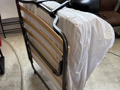 Folding guest bed with mattress