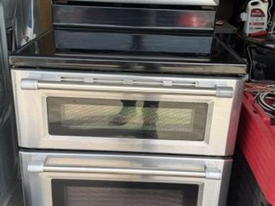 Maytag Stainless Steel Double Oven Electric Range with Glass Cooktop.