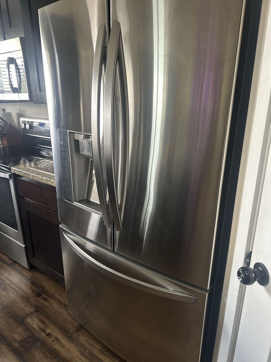 Sleek stainless steel fridge - needs a new compressor