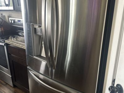 Sleek stainless steel fridge - needs a new compressor