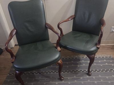 Pair of Vintage Dark Green Leather Armchairs with Nailhead Trim and Carved Wood Legs