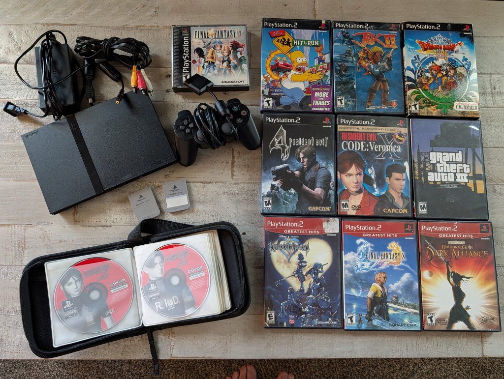 Sony PlayStation 2 Slim Bundle - Includes PS1 & PS2 Games