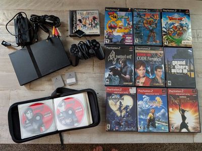 Sony PlayStation 2 Slim Bundle - Includes PS1 & PS2 Games