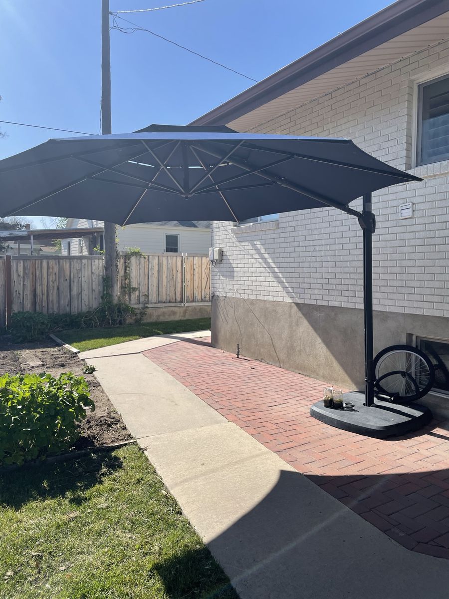 Collapsible outdoor umbrella with solar lighting