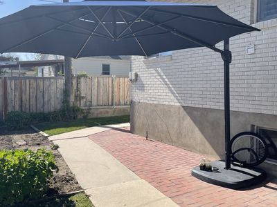 Collapsible outdoor umbrella with solar lighting