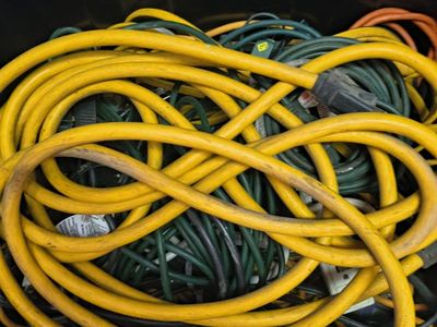 Assorted Extension Cords & Surge Protectors in HART 17 Gallon Storage Box