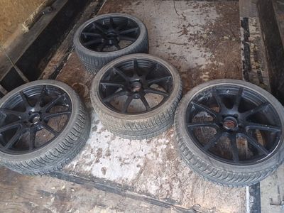 Set of 4 Bridgestone 255/35R19 Winter Tires with Black Alloy Wheels