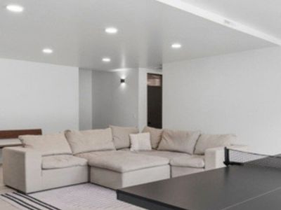 Spacious Beige DownEast Home feather Modular Sectional Sofa - Perfect for Living Rooms and Basements