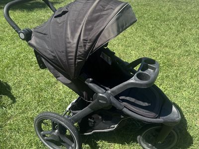 Graco Black Jogging Running Stroller with Child Tray and Canopy just Power washed. Works great. Wheels hold air.