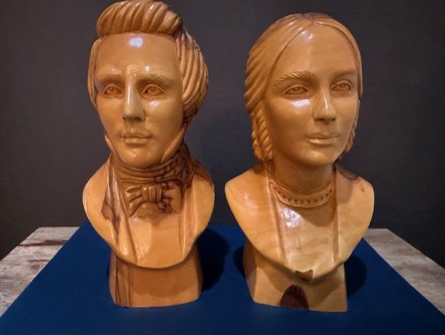 Joseph and Emma Smith busts carved from olive wood by Omar Bakri