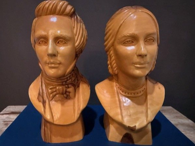 Joseph and Emma Smith busts carved from olive wood by Omar Bakri