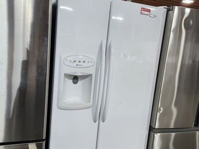 NICE MAYTAG SIDE BY SIDE FRIDGE!! WITH A FULL WARRANTY