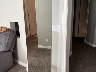 Full-Length Swivel Mirror with Storage Shelf and Coat Hooks