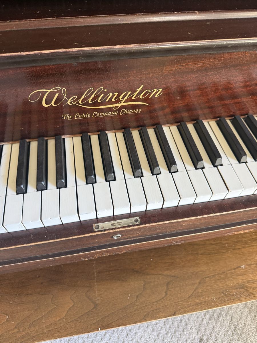 Antique upright grand piano
