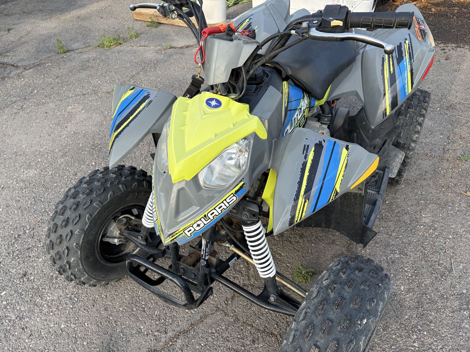 Polaris Outlaw 110 EFI Youth ATV - Grey/Yellow/Blue, Excellent Condition, Ready to Ride!