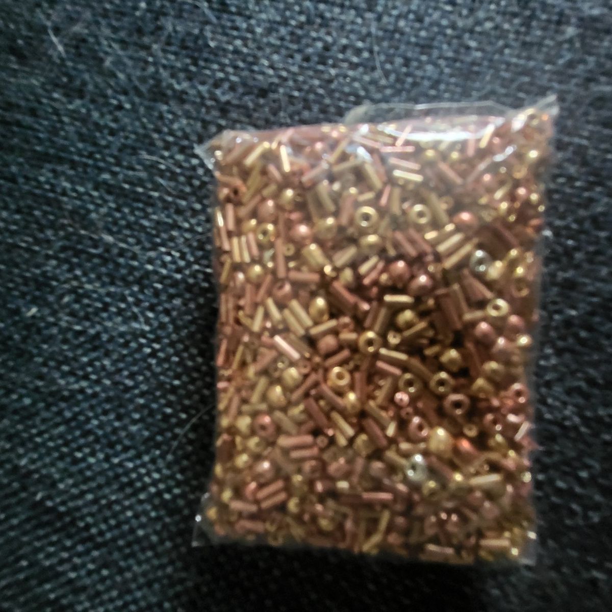 bunch of glass beads gold and bronze