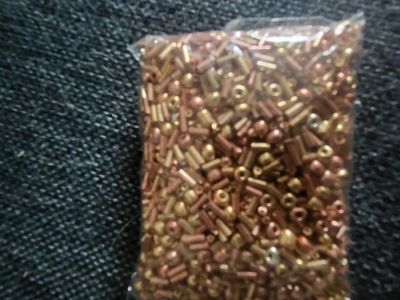 bunch of glass beads gold and bronze