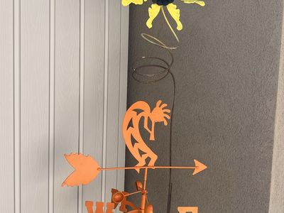 Tall flower Kokopelli yard decor