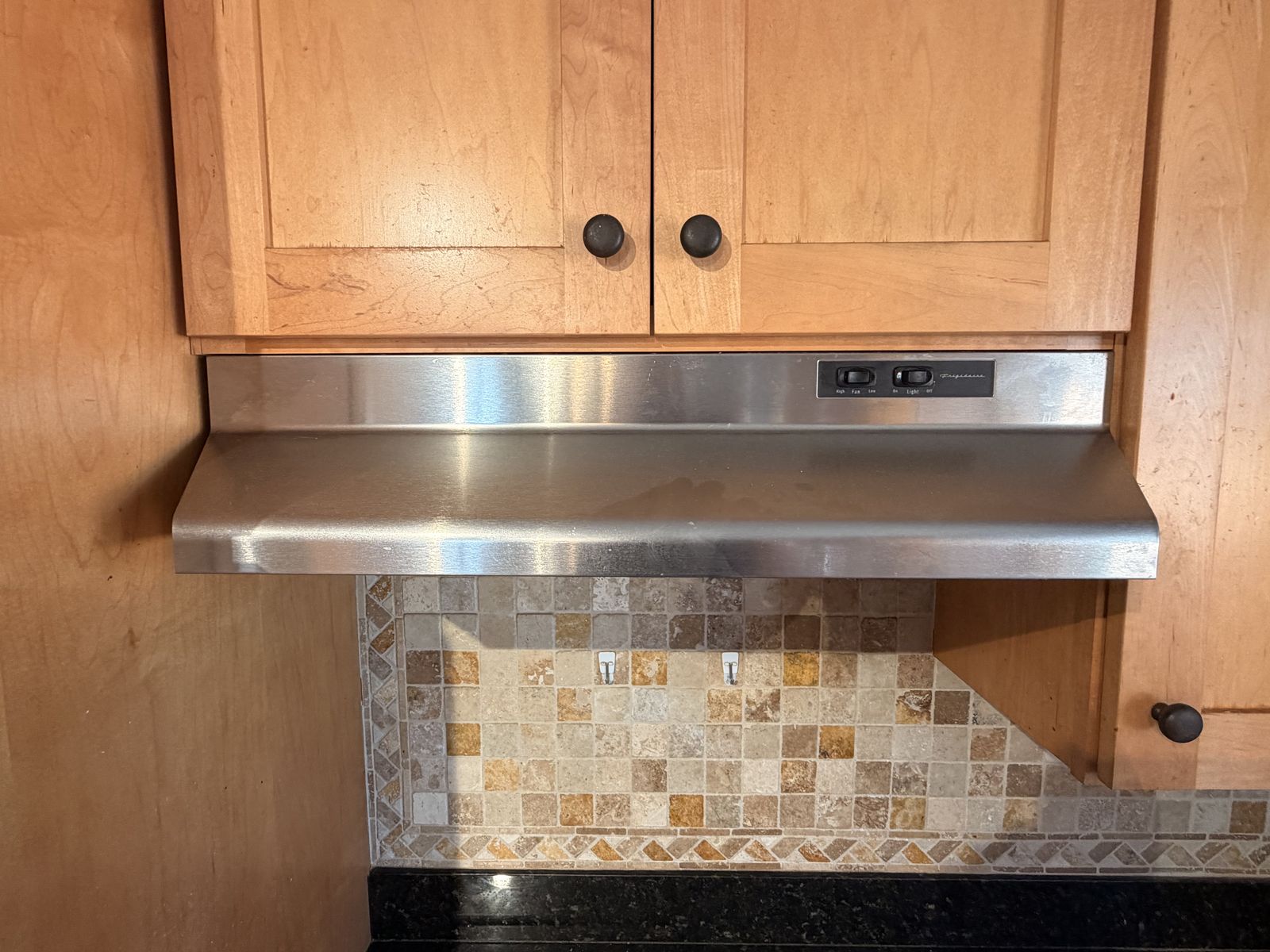 The Frigidaire is a 30-inch under-cabinet range hood - Stainless Steel