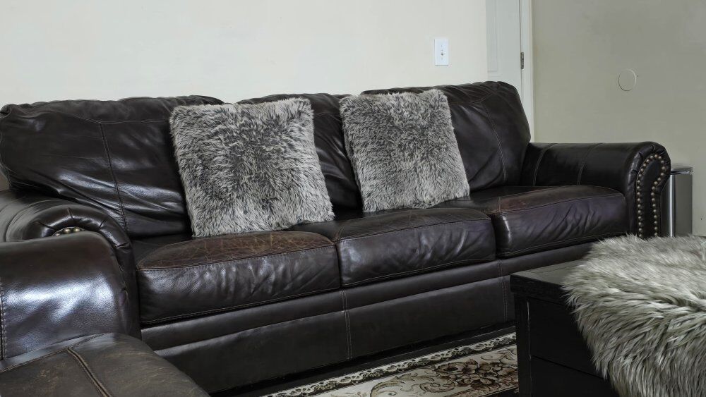 2 large espresso leather couches