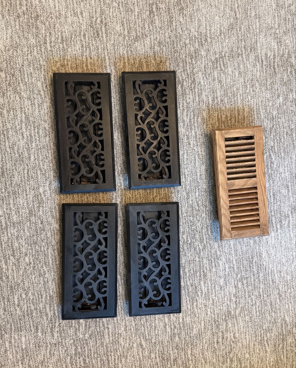 Four cast iron floor registers