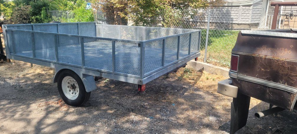 Single Axle Utility Trailer with Mesh Sides and Steel Frame