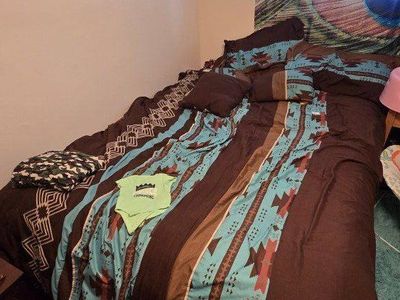 Queen sized bed with mattress, pillows and sheets