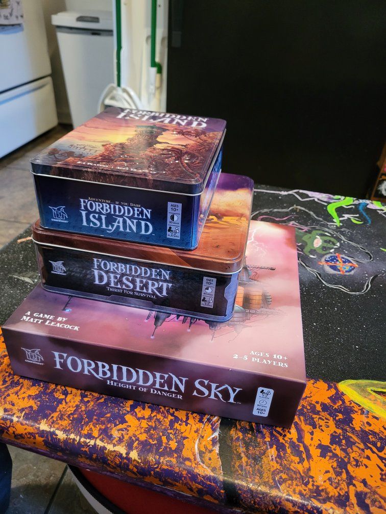 Forbidden Trilogy by Matt Leacock
(Forbidden Island, Forbidden Desert, Forbidden Sky)