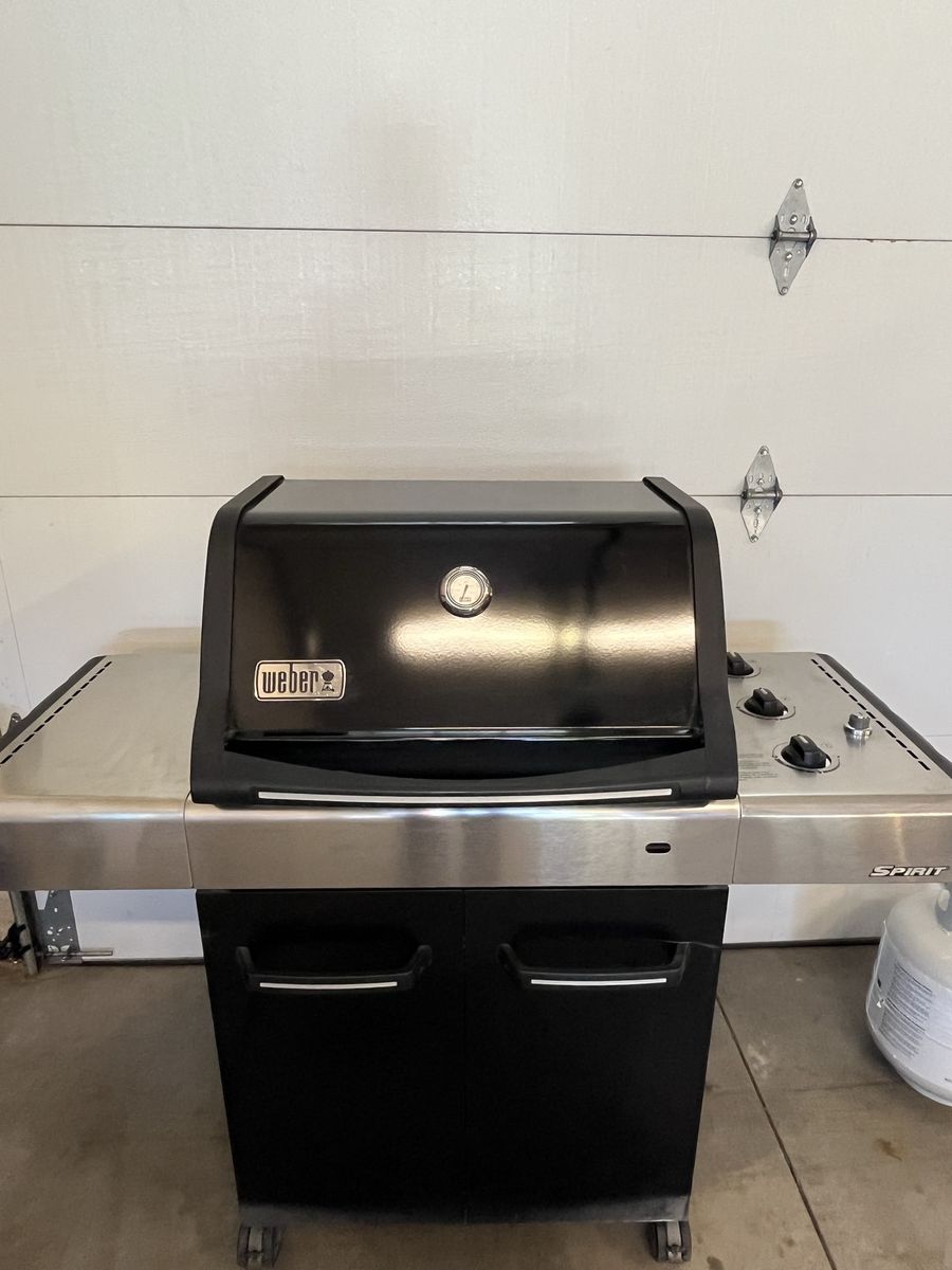 Weber three burner Spirit Grill plus two bottles of propane.