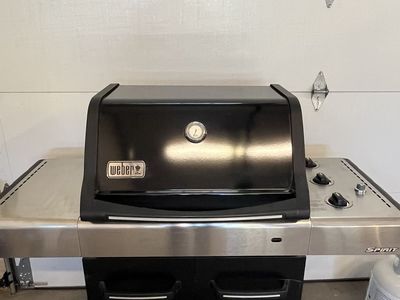Weber three burner Spirit Grill plus two bottles of propane.