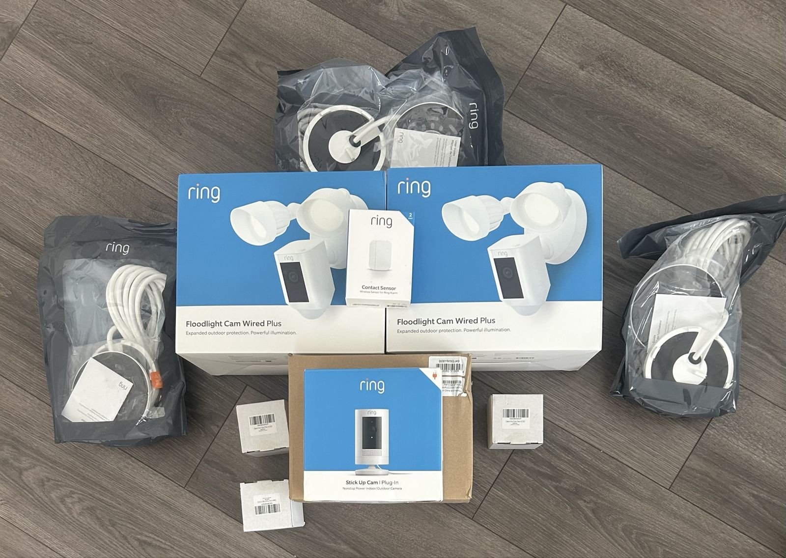 Ring Floodlight Cam Wired Plus (x2), Stick Up Cam Plug-In, Contact Sensor, & Accessories