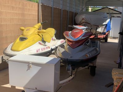 Pair of Sea-Doo Personal Watercraft (Yellow & Red/Gray) - Perfect for Summer Fun!