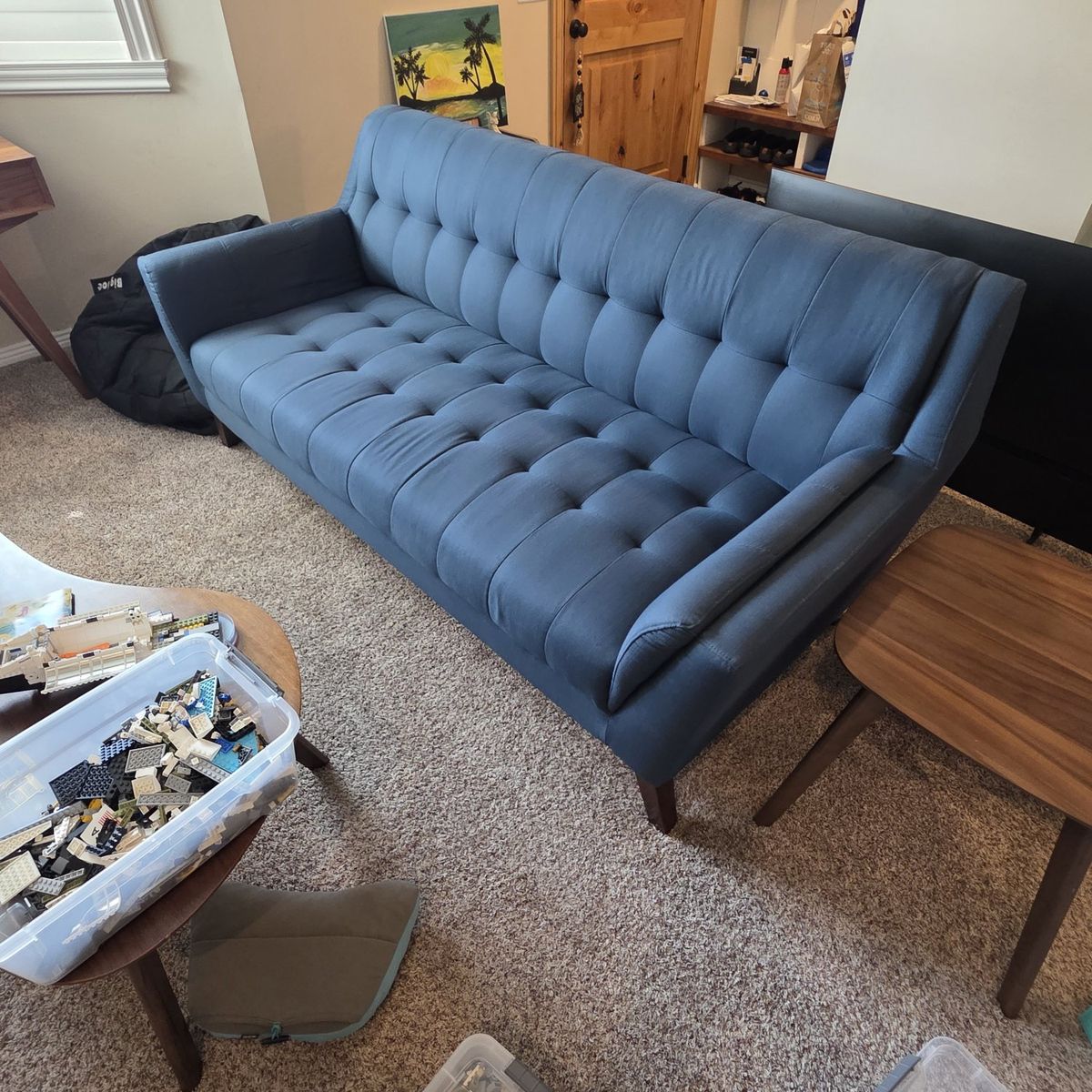 midcentury tufted blue couch
