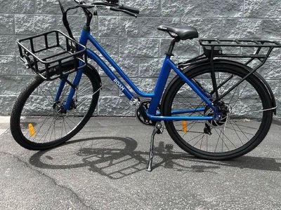 NEW Pair of ROAM Integral Electrics/Electric Bike Co. E-bikes. 1-White and 1-Blue