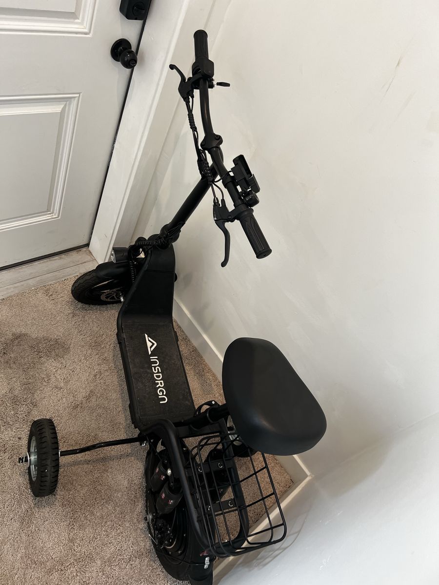 INSDRGN 2-Wheel Electric Scooter with Seat and Rear Basket. Training wheels were bolted to it, which can easily be removed.