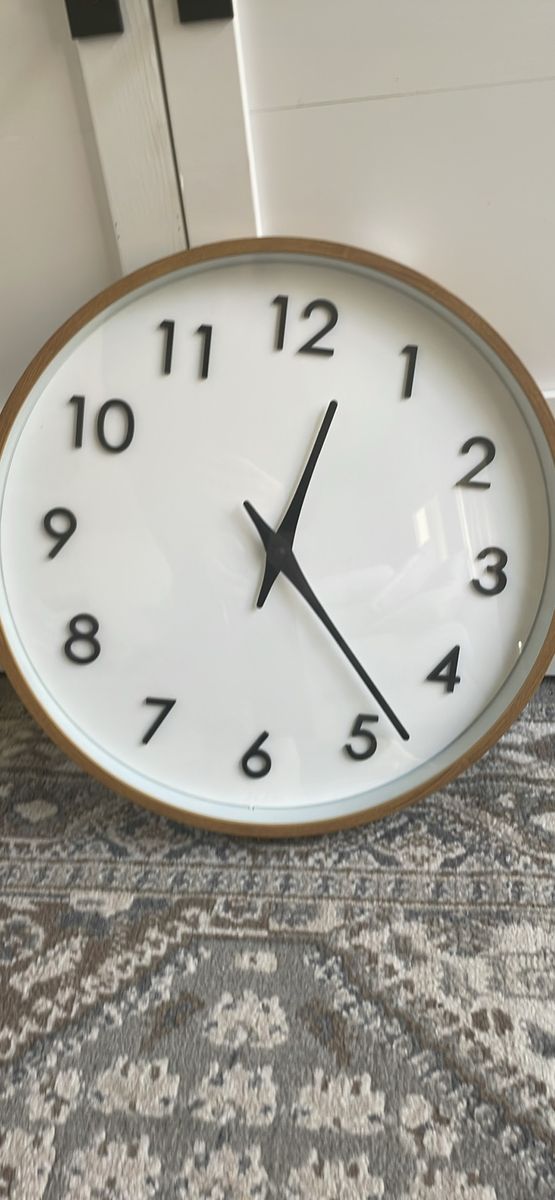 20-inch quartz modern wall clock featuring a light wood finish frame