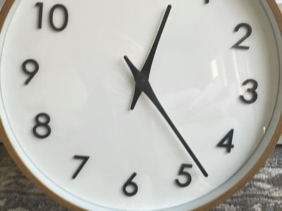 20-inch quartz modern wall clock featuring a light wood finish frame