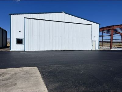 60 Wide x 50 Deep Airplane Hangar Building - Large Steel Structure with Bifold Door