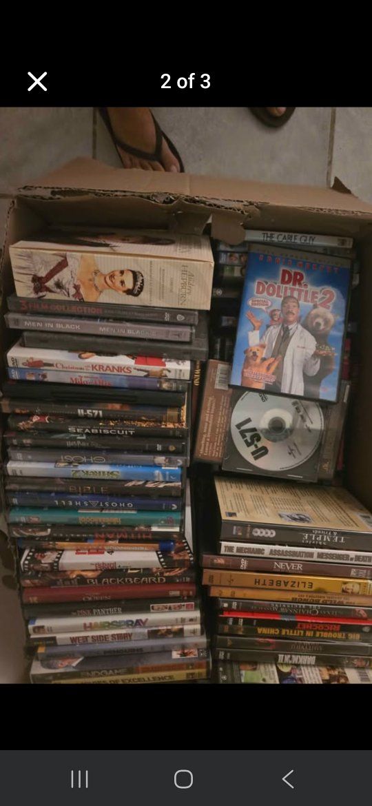 Large Lot of Mixed DVD Movies with a DVD Player
