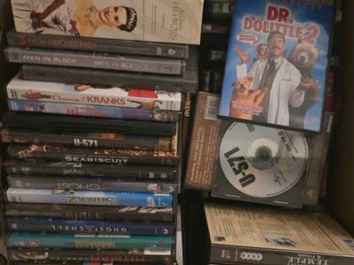 Large Lot of Mixed DVD Movies with a DVD Player