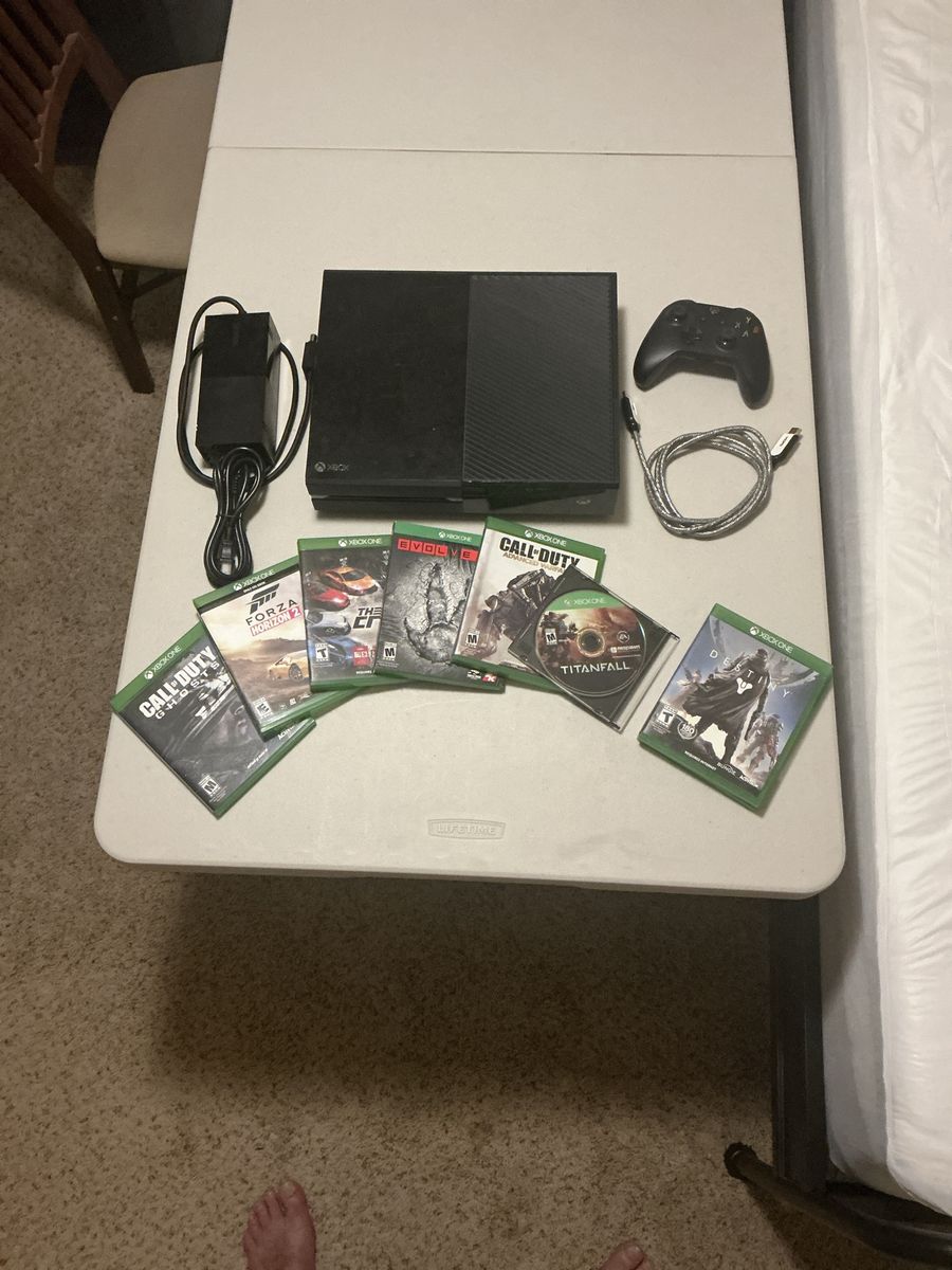 Xbox One Console with Controller, Power Supply, and 8 Games.