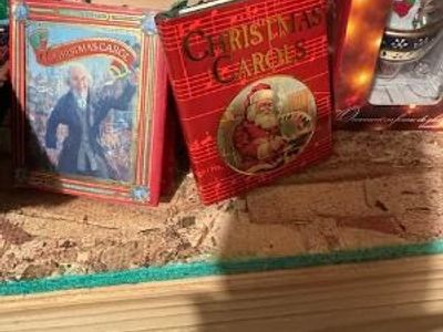 A Christmas Carol” by Charles Dickens and generic “Christmas Carols” book