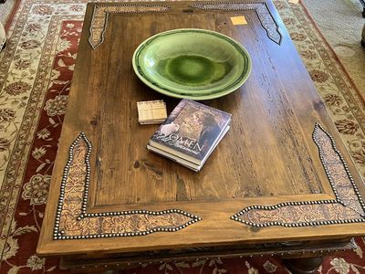 Rustic Wood Coffee Table with Decorative Embossed Metal Accents
