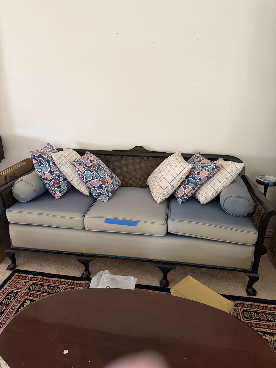 Vintage Cane Back Sofa Couch with Blue Cushions & Floral Accent Pillows