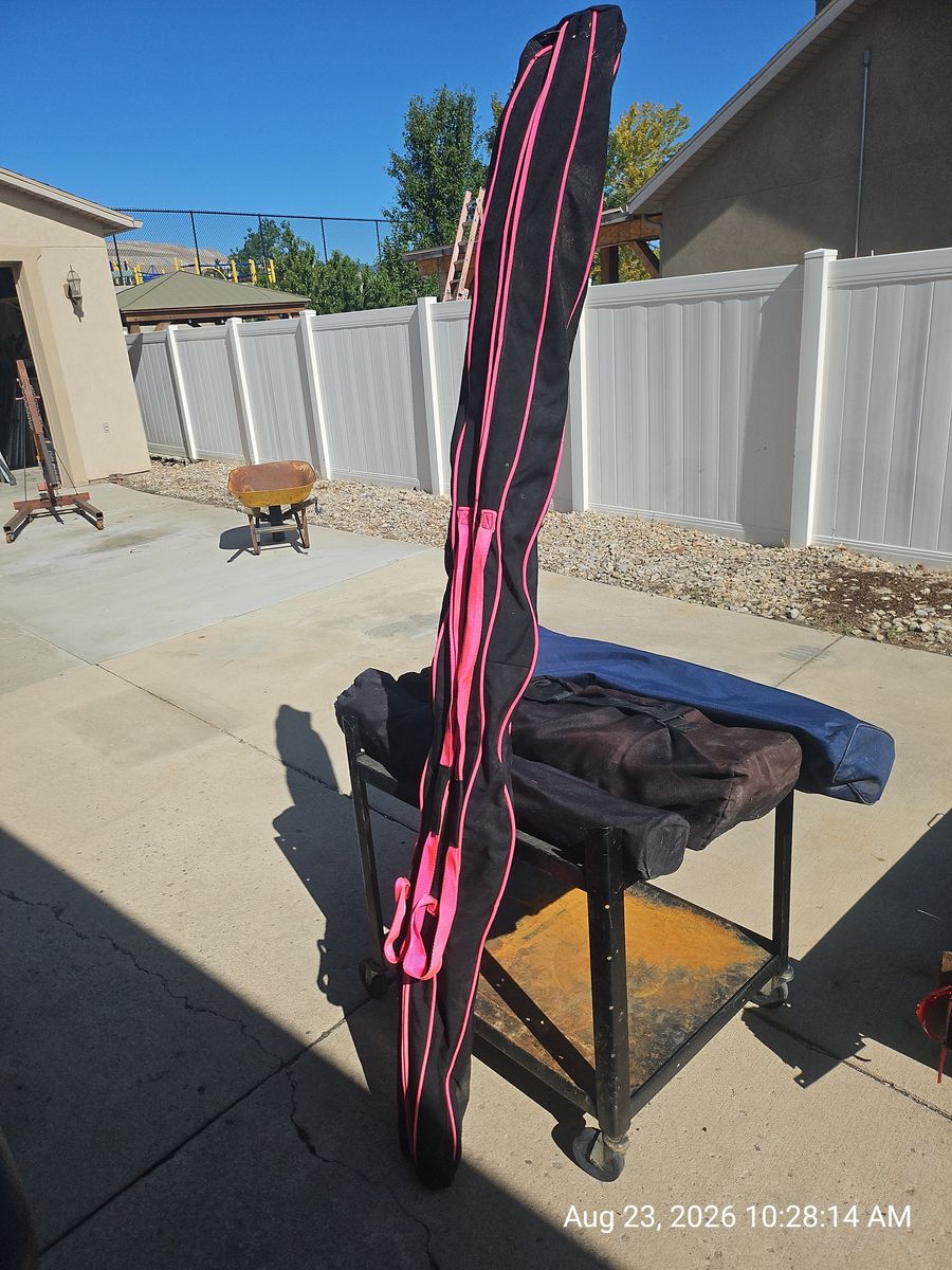 K2 Extreme Downhill Skis with Marker Bindings and Poles in Bag