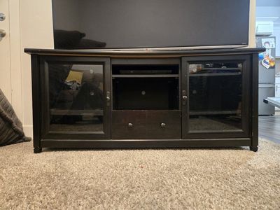FREE - Black Wood TV Stand Media Console with Glass Doors & Storage Drawer.