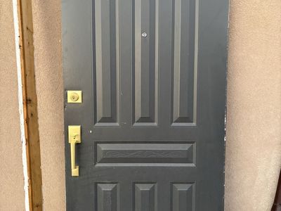 Exterior door with hardware and frame